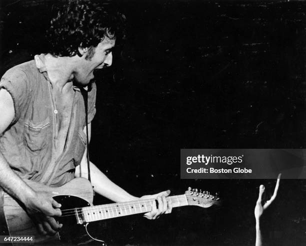 Fan reaches out for Bruce Springsteen during a concert at the Boston Garden in Boston on Sep. 25, 1978.