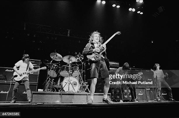 Australian heavy rock group AC/DC performing in New York, August 1979. Left to right: Malcolm Young, Phil Rudd , Angus Young, Cliff Williams and Bon...