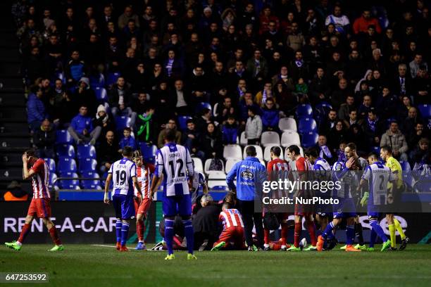 Fernando Torres forward of Atletico de Madrid falls unconscious on the ground after a blow with Alex Bergantiños of Deportivo de La Coruña during the...