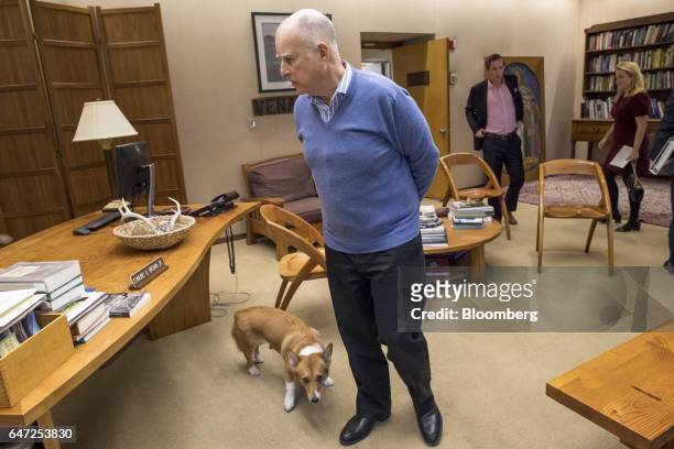 Jerry Brown, governor of California, stands in his office after an interview at the State Capitol in Sacramento, California, U.S., on Thursday, March...