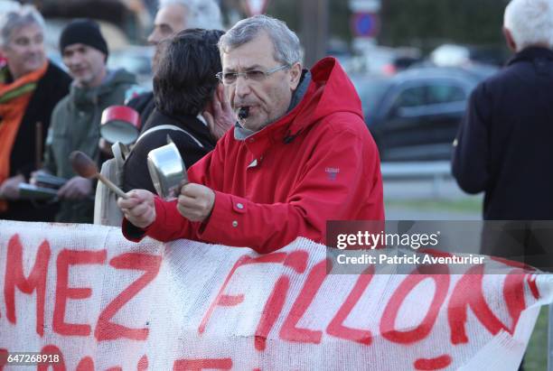 Protestors demonstrate against Les Republicans political party candidate for the 2017 presidential election Francois Fillon candidate during a...