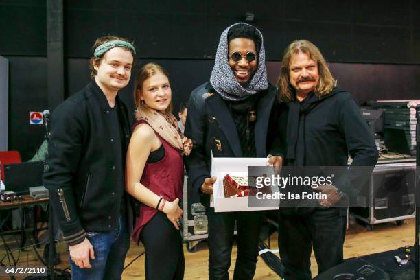 Leslie Mandoki with his kids Julia Mandoki and Gabor Mandokis and US organist, composer and Gospel star Cory Henry with his birthday cake during the...