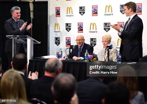 Los Angeles King's announcer Bob Miller receives an ovation from members of the press, announcer NickNickson and President of business operations for...