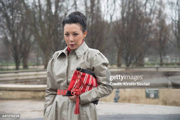 Fashion buyer Jeannie Lee wears a Alessandra Rich and a Balenciaga clutch bag on day 2 during Paris Fashion Week Autumn/Winter 2017/18 on March 1,...