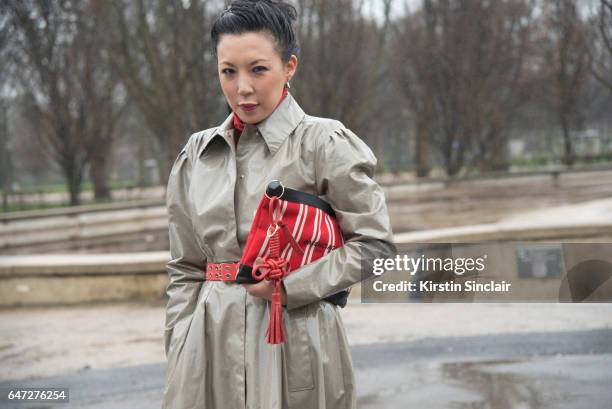 Fashion buyer Jeannie Lee wears a Alessandra Rich and a Balenciaga clutch bag on day 2 during Paris Fashion Week Autumn/Winter 2017/18 on March 1,...