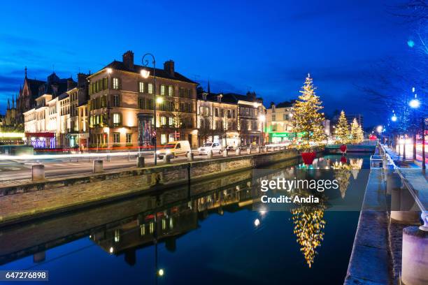 Christmas lights in Troyes . Christmas trees over the Canal de la Haute-Seine along the quays "quais des Comtes de Champagne".