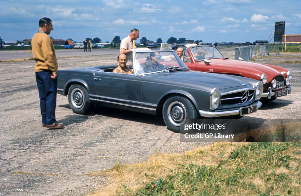 Stirling Moss and Rob Walker 230sl at Silverstone.