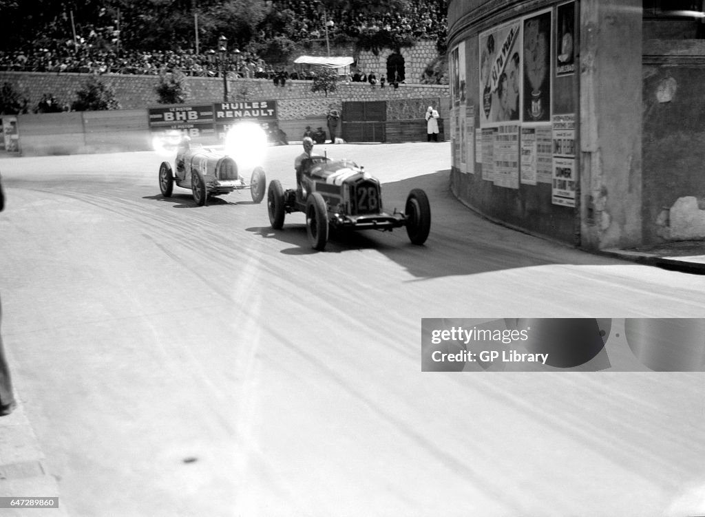 Tazio Nuvolari in the alfa leads Achille Varzi in the bugatti.