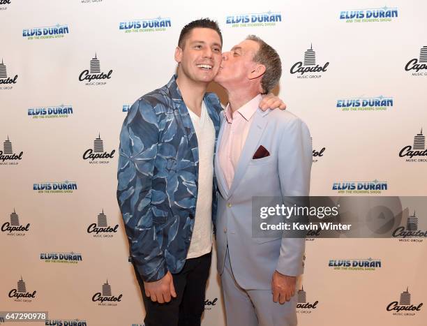 Elvis Duran and his partner Alex Carr pose at a reception celebrating radio personality Elvis Duran's star on the Hollywood Walk of Fame at Capitol...