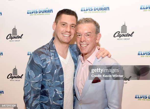 Elvis Duran and his partner Alex Carr pose at a reception celebrating radio personality Elvis Duran's star on the Hollywood Walk of Fame at Capitol...