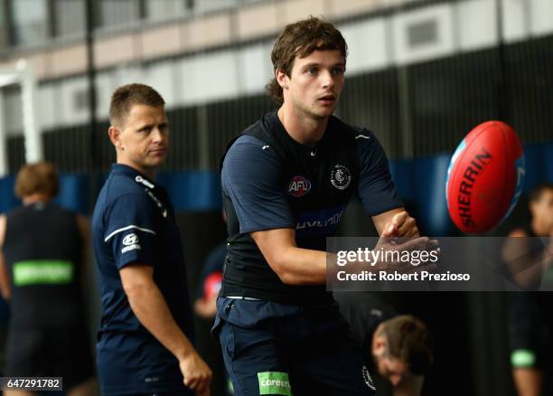 Dylan Buckley handballs during a Carlton Blues AFL media opportunity at Ikon Park on March 3, 2017 in Melbourne, Australia.