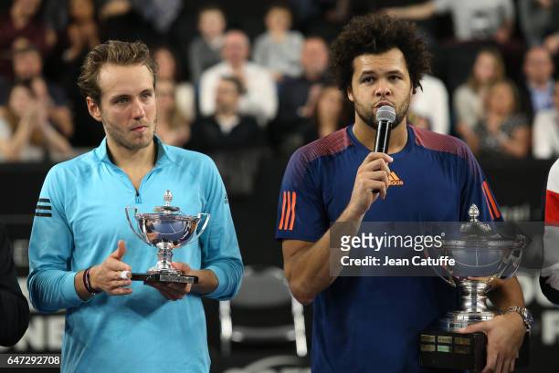 Finalist Lucas Pouille of France and winner Jo-Wilfried Tsonga of France pose during the trophy ceremony following their final at the Open 13, an ATP...