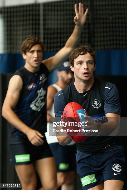 Dylan Buckley looks to handball during a Carlton Blues AFL media opportunity at Ikon Park on March 3, 2017 in Melbourne, Australia.