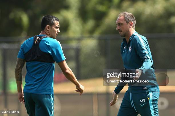 Coach Michael Valkanis gives instructions as Tim Cahill looks on during a Melbourne City FC training session at City Football Academy on March 3,...