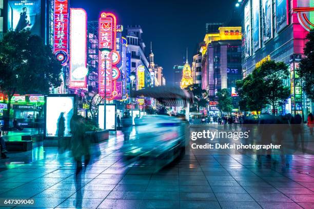 nanjing road at night shanghai - china street stock pictures, royalty-free photos & images