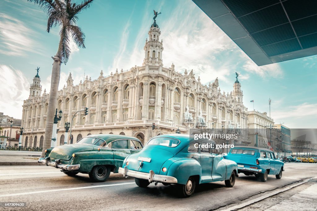 Old blue american car in front of Gran Teatro of Havanna