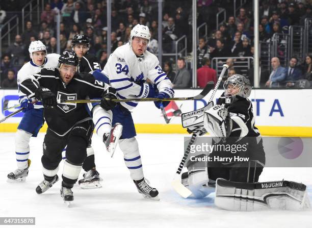 Auston Matthews of the Toronto Maple Leafs attempts a deflection on Jonathan Quick of the Los Angeles Kings as Alec Martinez defends during the first...