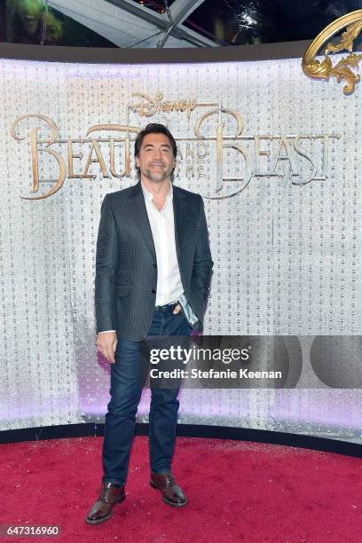 Javier Bardem arrives at the world premiere of Disney's new live-action "Beauty and the Beast" photographed in front of the Swarovski crystal wall at...