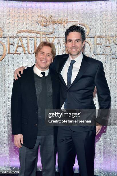 Stephen Chbosky and Alex Young arrive at the world premiere of Disney's new live-action "Beauty and the Beast" photographed in front of the Swarovski...