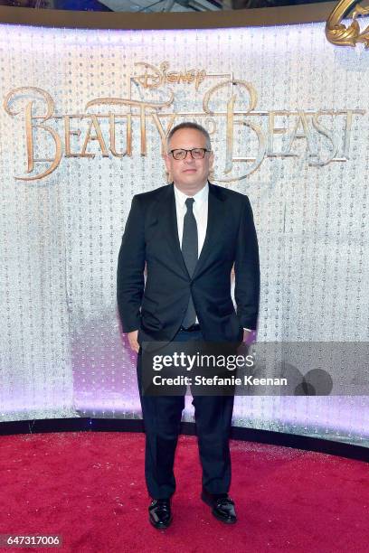 Bill Condon arrives at the world premiere of Disney's new live-action "Beauty and the Beast" photographed in front of the Swarovski crystal wall at...
