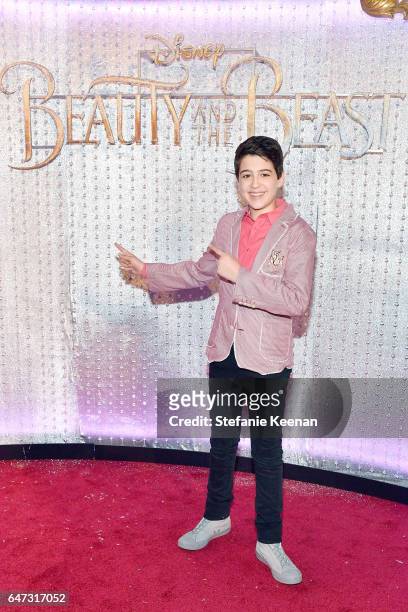 Joshua Rush arrives at the world premiere of Disney's new live-action "Beauty and the Beast" photographed in front of the Swarovski crystal wall at...