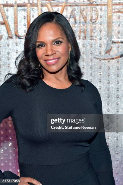 Audra McDonald arrives at the world premiere of Disney's new live-action "Beauty and the Beast" photographed in front of the Swarovski crystal wall...