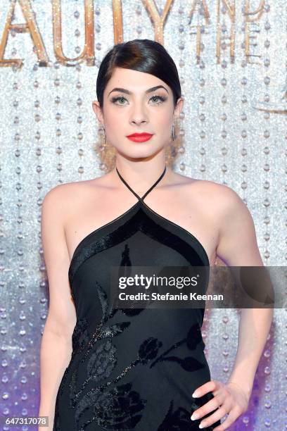 Nikki Koss arrives at the world premiere of Disney's new live-action "Beauty and the Beast" photographed in front of the Swarovski crystal wall at...