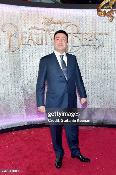 Evan Spiliotopoulos arrives at the world premiere of Disney's new live-action "Beauty and the Beast" photographed in front of the Swarovski crystal...