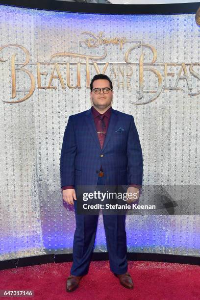 Josh Gad arrives at the world premiere of Disney's new live-action "Beauty and the Beast" photographed in front of the Swarovski crystal wall at the...