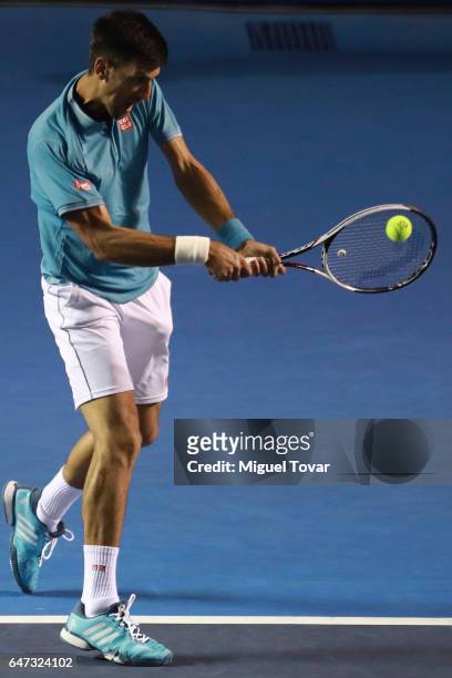 Novak Djokovic of Serbia returns the ball during the match between Novak Djokovic of Serbia and Nick Kyrgios of Australia as part of the Abierto...