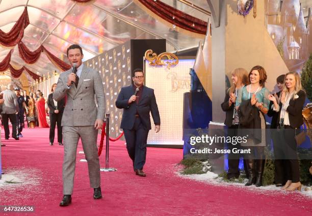 Actors Luke Evans and Josh Gad perform at the world premiere of Disney's live-action "Beauty and the Beast" at the El Capitan Theatre in Hollywood as...