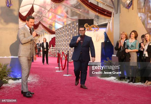 Actors Luke Evans and Josh Gad perform at the world premiere of Disney's live-action "Beauty and the Beast" at the El Capitan Theatre in Hollywood as...