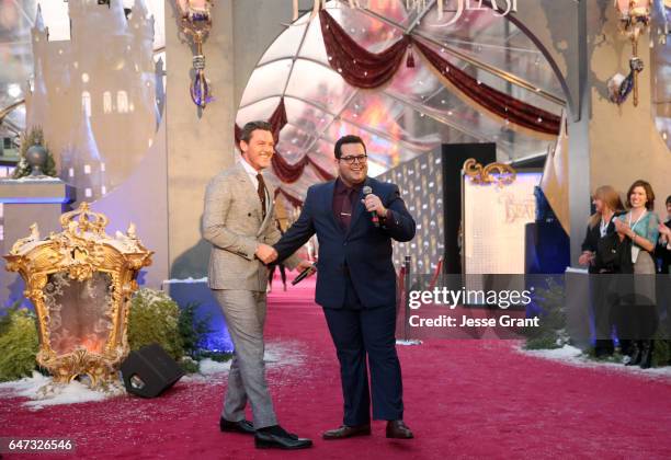 Actors Luke Evans and Josh Gad perform at the world premiere of Disney's live-action "Beauty and the Beast" at the El Capitan Theatre in Hollywood as...