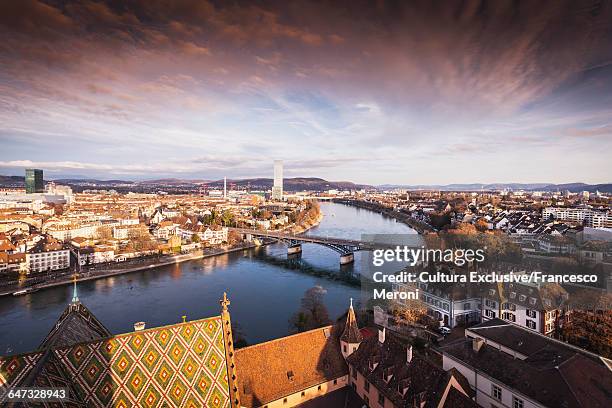 high angle view of river rhine and rooftops of basel, switzerland - bale stock-fotos und bilder