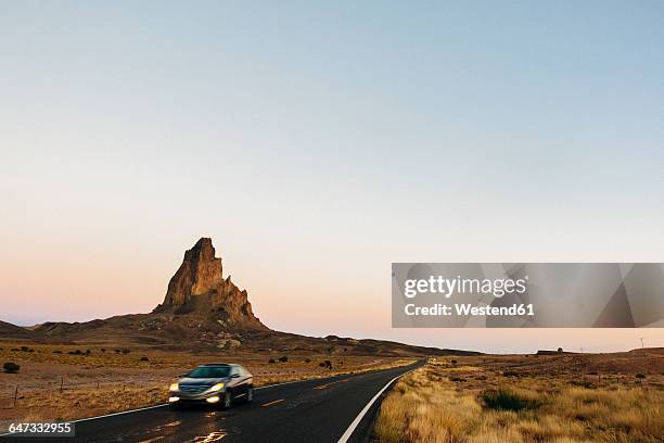 usa, utah, monument valley, car driving on the highway 163 - utah road stock pictures, royalty-free photos & images