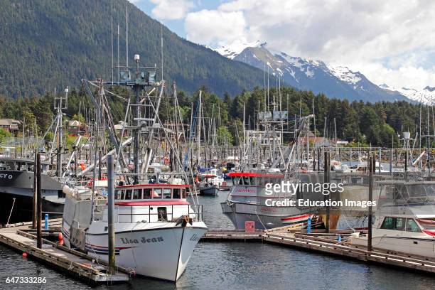 Fishing fleet Crescent Harbor marina mountains Sitka Alaska Inside Passage Southeast Alaska USA.