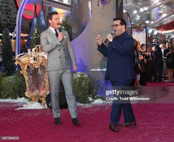 Luke Evans and Josh Gad sing a song at the premiere of Disney's "Beauty And The Beast" at El Capitan Theatre on March 2, 2017 in Los Angeles,...