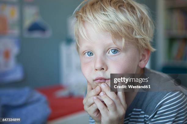 portrait of pensive little boy - touching eyes stock pictures, royalty-free photos & images