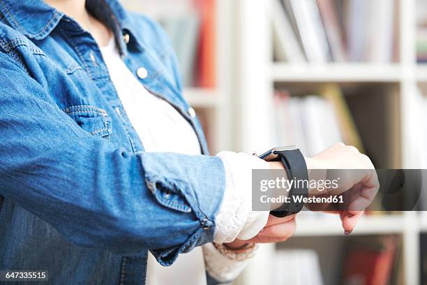 woman wearing smartwatch, close-up - wrist stock pictures, royalty-free photos & images
