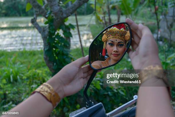 barong dancer, girl mirrored in mirror - balinese headdress stock pictures, royalty-free photos & images