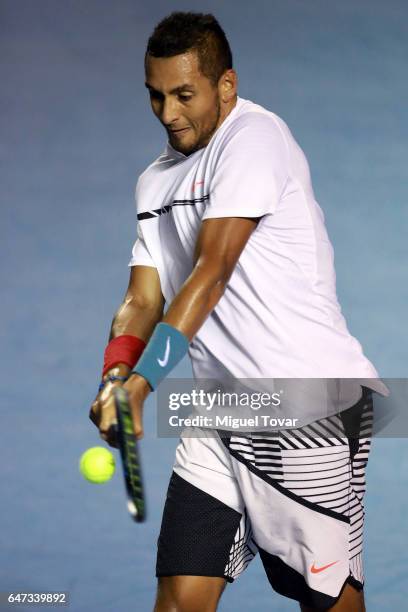 Nick Kyrgios of Australia returns the ball during the match between Novak Djokovic of Serbia and Nick Kyrgios of Australia as part of the Abierto...