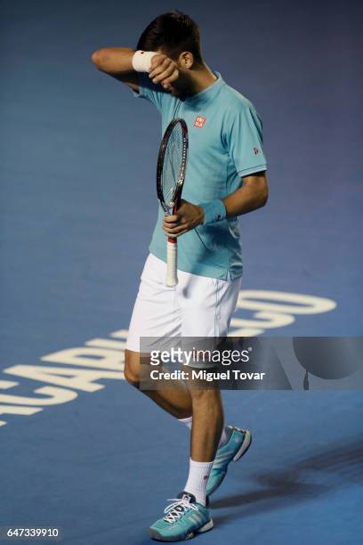 Novak Djokovic of Serbia dries his sweat during the match between Novak Djokovic of Serbia and Nick Kyrgios of Australia as part of the Abierto...