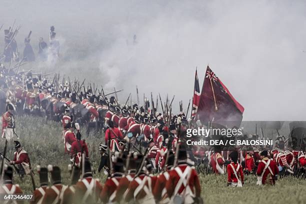 British troops shrouded in rifle smoke, Battle of Waterloo, 1815. Napoleonic Wars, 19th century. Historical reenactment.