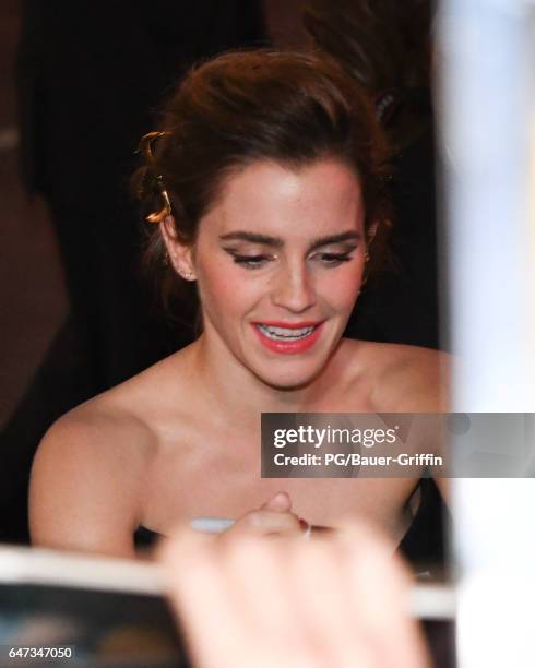 Emma Watson is seen signing autographs for fans as she arrives at the premiere of "Beauty and the Beast" on March 02, 2017 in Los Angeles, California.