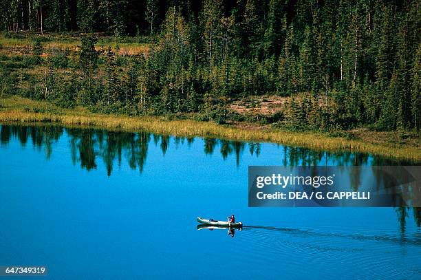 The Yukon River between Whitehorse and Dawson City, with a canoe, Klondike, Alaska, United States of America.