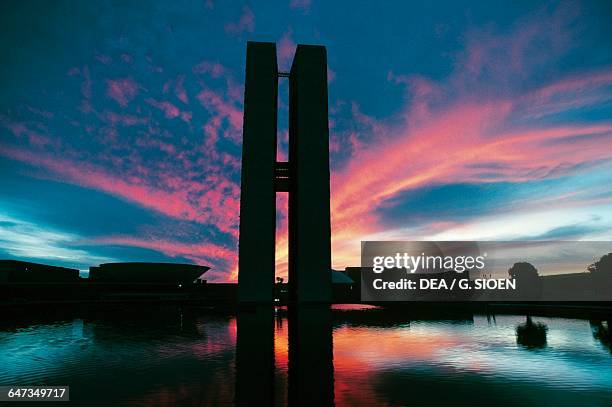 Three Powers Square and National congress at sunset by Oscar Niemeyer , Brasilia , Federal District. Brazil, 20th century.