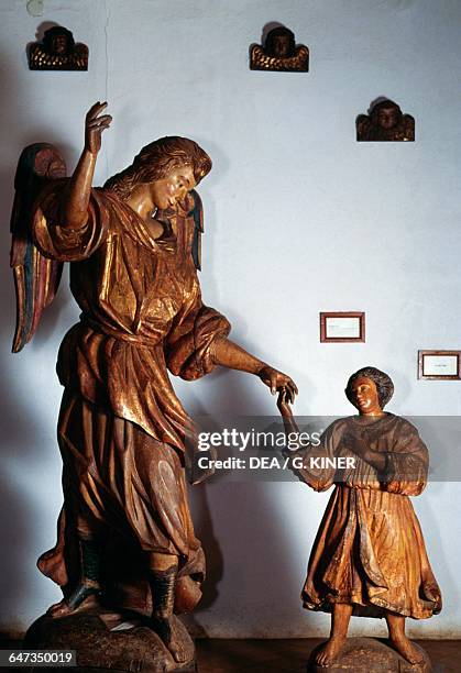 Archangel Raphael and young Tobias, polychrome wooden sculpture, Guarani Baroque style, San Ignacio Guazu, Misiones, Paraguay.