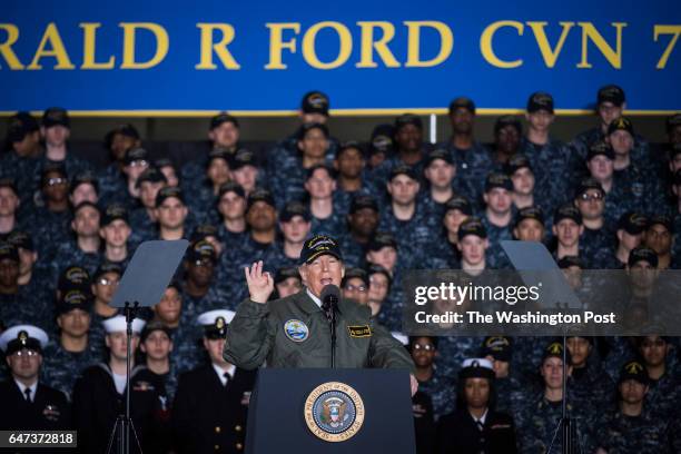 President Donald Trump speaks to Navy and shipyard personnel aboard nuclear aircraft carrier Gerald R. Ford at Newport News Shipbuilding in Newport...