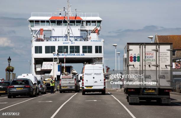 Cars, trucks and vans in line for the roll on roll off ferry to the mainland.