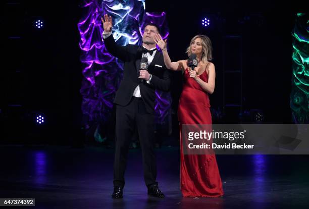 Hosts Brian Stann and Nicole Dabeau appear on stage during the ninth annual Fighters Only World Mixed Martial Arts Awards at The Venetian Las Vegas...